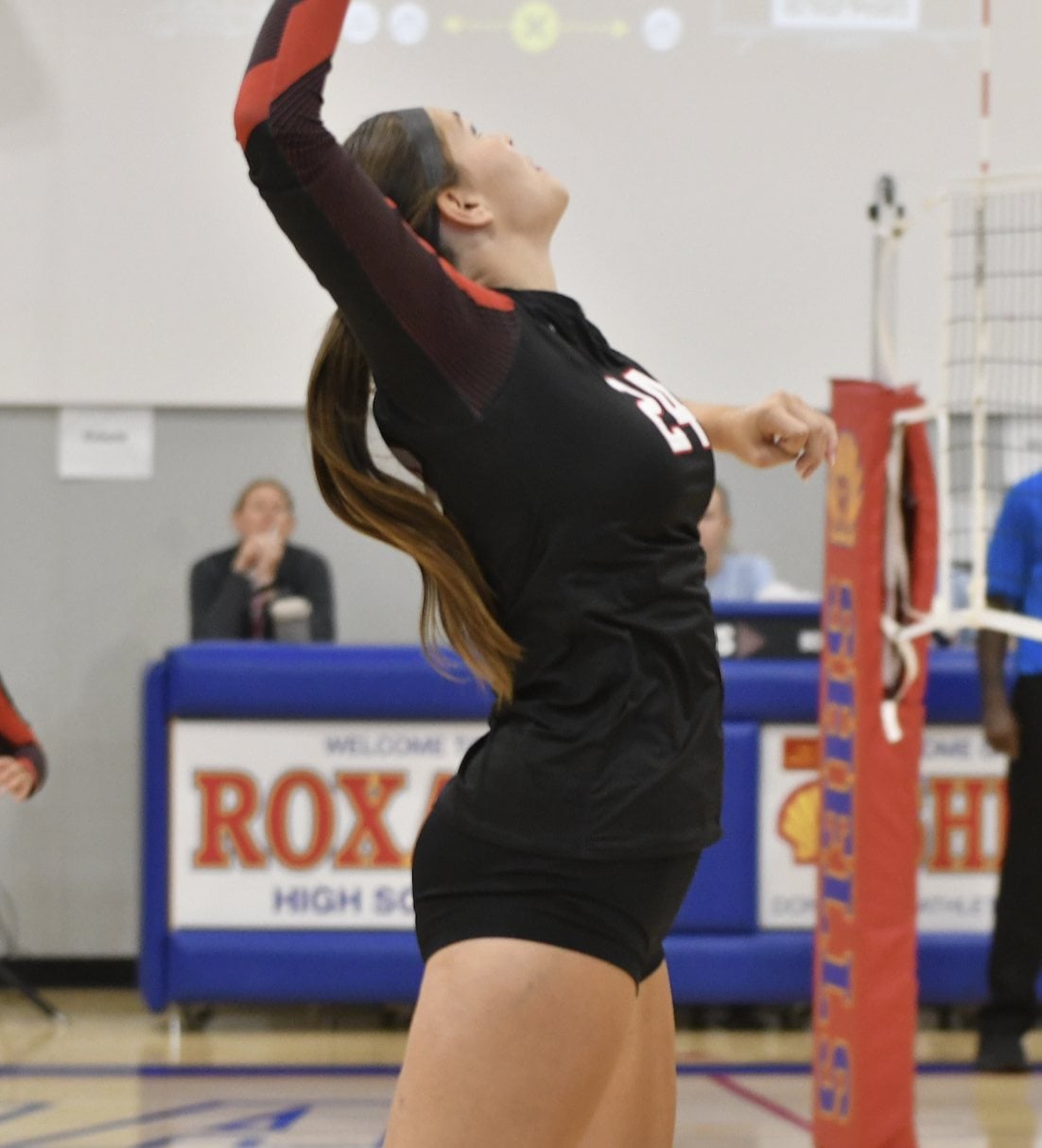 Lilly Pelletier, a senior middle hitter for the Warriors.