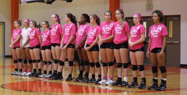 The Tigers show their support by donning special shirts for the Volley for the Cure game. 