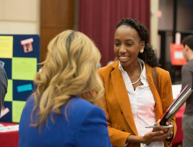 Paula Clarke, of Chicago, gathers information about the master’s in business administration during the 2015 SIUE Graduate School Open House.