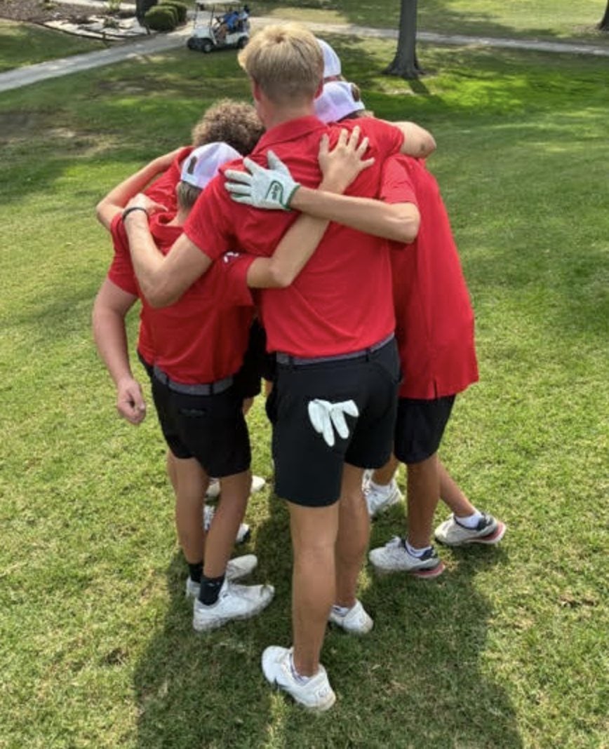 Landon Mayer celebrates his state qualification with teammates.