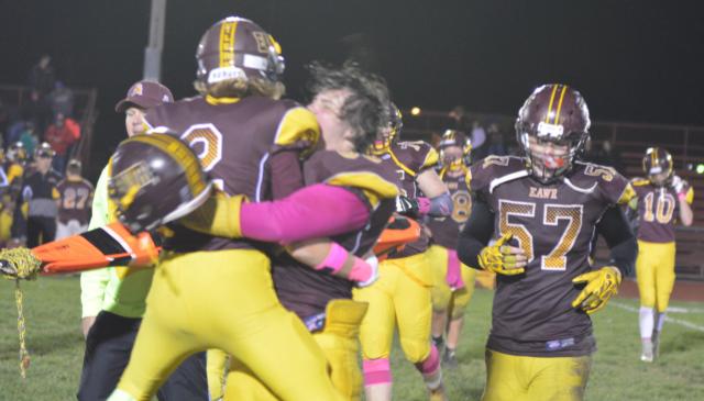 Players react with a moment of jubiliation following East Alton-Wood River's 13-6 triumph over South Fork on Friday night. The victory gives the Oilers an edge on advancing to the playoffs. (Photo by Dan Brannan)