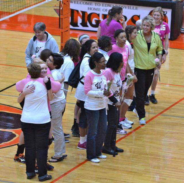 Edwardsville players honor breast cancer survivors before the game during Volley for the Cure on Thursday. (Photo by Dan Brannan)