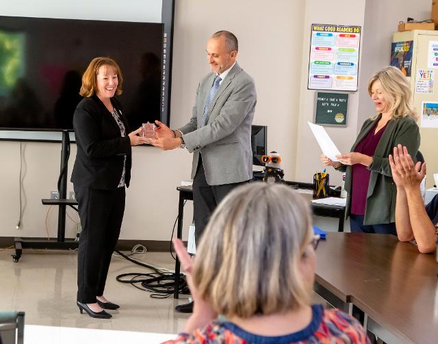 L&C President Ken Trzaska and Associate Dean of Adult Education (and COABE member) Val Harris present Rep. Amy Elik (left) with an award Friday, Oct. 7, at Lewis and Clark’s Scott Bibb Center in Alton. Photo by Jan Dona, L&C Marketing/PR