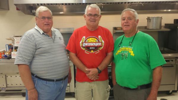From left to right: Phil Berger, John Schwegel and Jim Keenan, are appropriately nicknamed “The Backbone Brothers,” of the St. Mary’s Oktoberfest. The trio volunteer nearly non-stop from beginning to end at the popular fall festival.