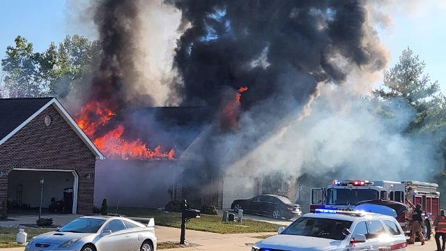 The scene early in the fire on Seasons Drive. (Photo by Steve Schuenke).