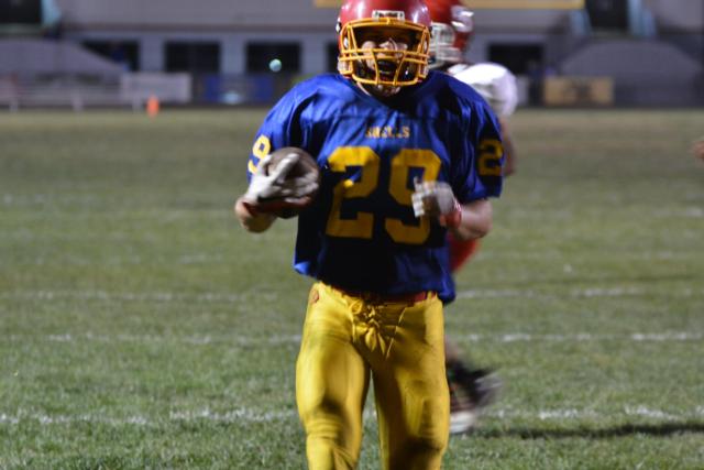 Roxana's Joey Johnson goes in for one of his scores on Friday night against Staunton. (Photo by Dan Brannan)