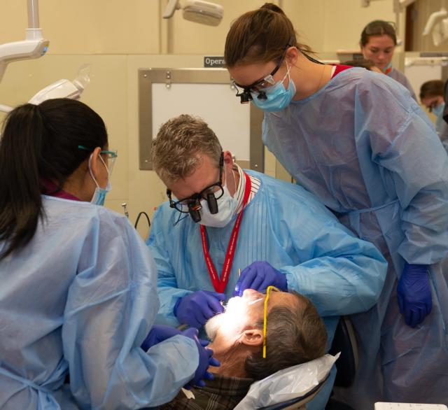 A veteran receives dental care during the 2018 SIU School of Dental Medicine’s Veteran’s Care Day.