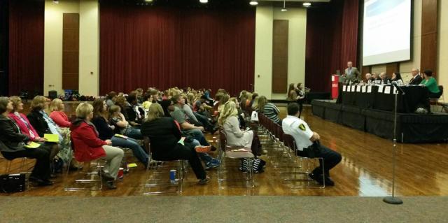 A pair of students present to panelists at the 2016 Madison County Youth Forum.