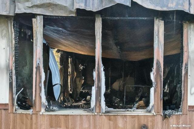 This is the charred remains of a trailer in Brighton where a woman died in a fire early Friday morning. (Photos courtesy of Michael Weaver)