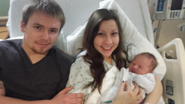 Cory Douglas and Kellie Lavite of Wood River share the first baby born in Madison County in 2015.