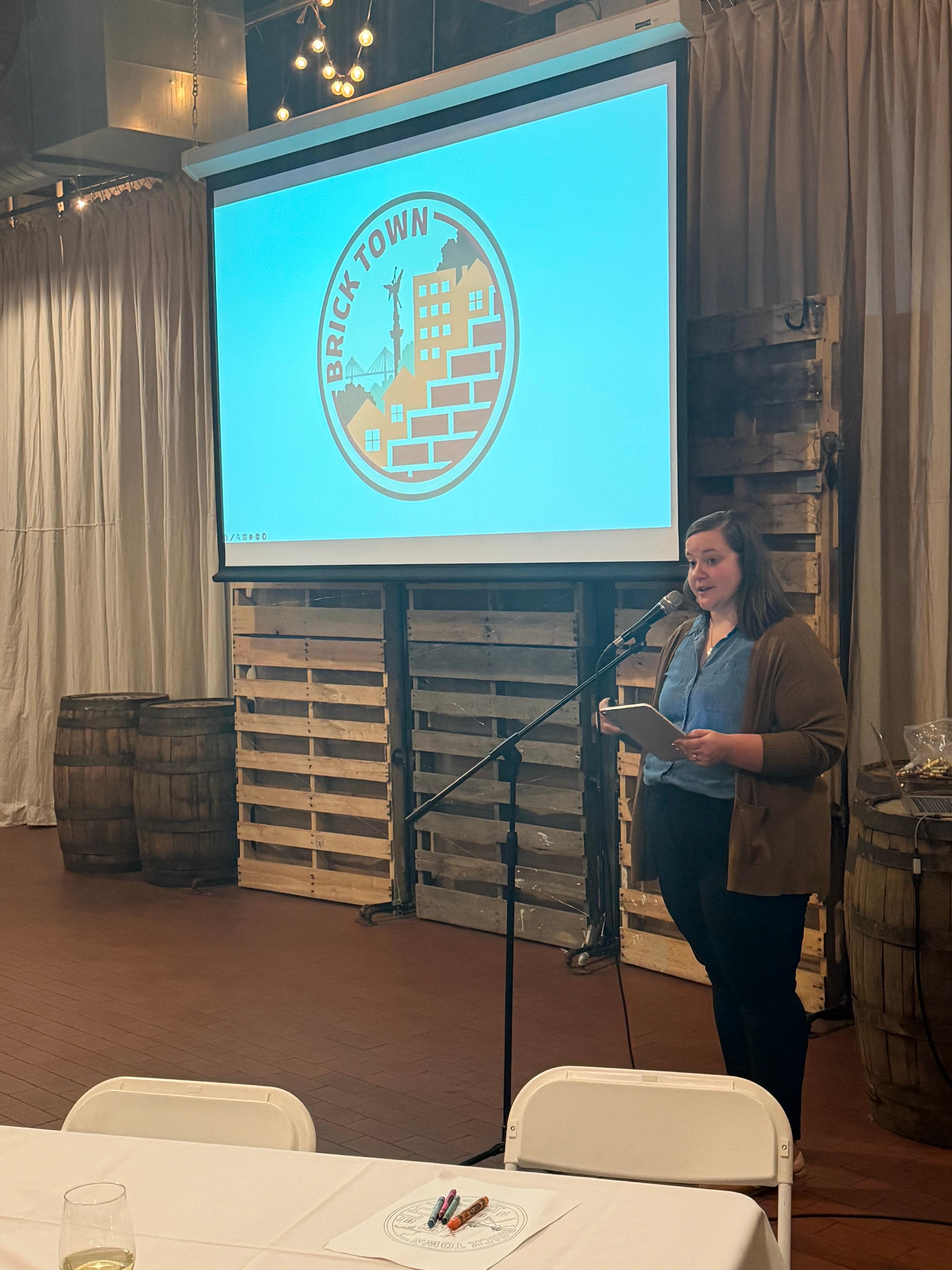Megan Armentrout-Steward presenting the new logo on Oct. 21, 2026.