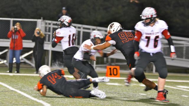 A.J. Epenesa pushes his way in to put pressure on Granite City's quarterback. 
