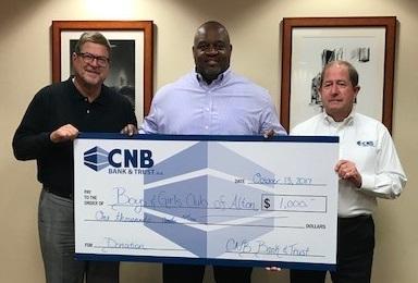 $1,000 Check presented from left to right, Michael Drake, Al Womack and Larry Franklin.