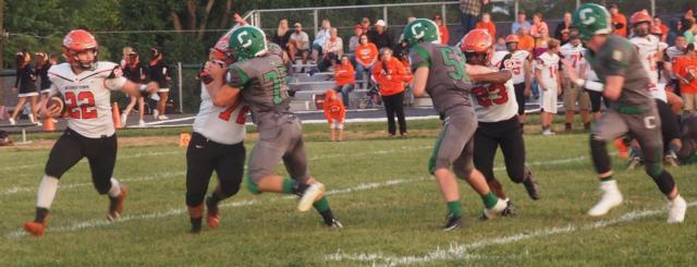 Isaac Cox, Logan Shaw, and Cameron Pennell pursue a Beardstown running back.
