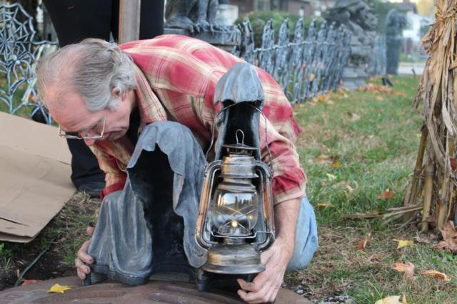 Steve O'Dell puts some of the finishing touches on The Halloween House's display. 