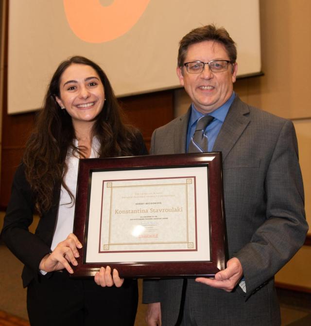 Konstantina “Nina” Stavroulaki receives the SIUE 2019 Outstanding Teaching Assistant award for the master’s level from Graduate School Dean Jerry Weinberg. 