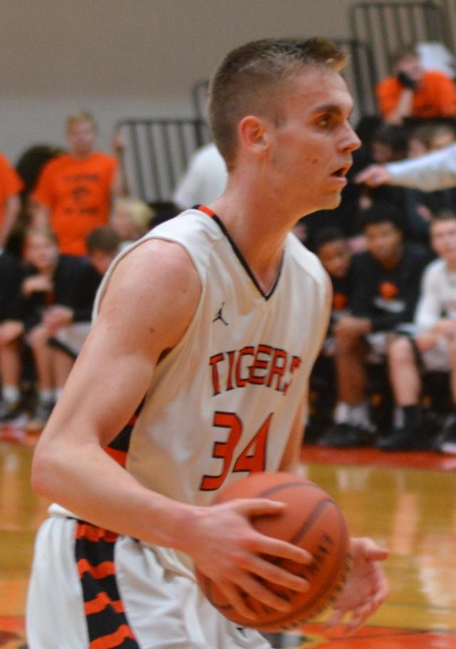 Caleb Strohmeier used his height against East St. Louis on Tuesday night to collect 10 rebounds to go with nine points. He was a key in the Tigers' win over the Flyers. (Photo by Dan Brannan) 