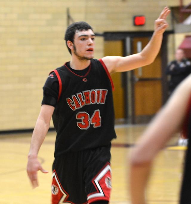 Jared Brackett raises his hand for a play signal late in the game against East Alton-Wood River on Tuesday night. (Photo by Dan Brannan)