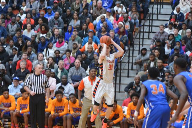 Oliver Stephen lets a three-point shot fly for the Tigers against the Flyers. Stephen had 15 points in the game. (Photo by Dan Brannan)