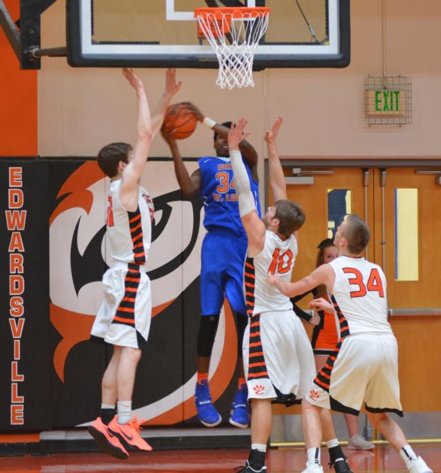 The Tigers' Oliver Stephen (left), Nathan Kolesa and Caleb Strohmeier were outstanding on the defensive side on Tuesday against East St. Louis. (Photo by Dan Brannan)