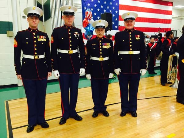 Four Marines await the arrival of US Marine Cpl. Jordan A. Cook at North Elementary School in Godfrey, Jan 4.
