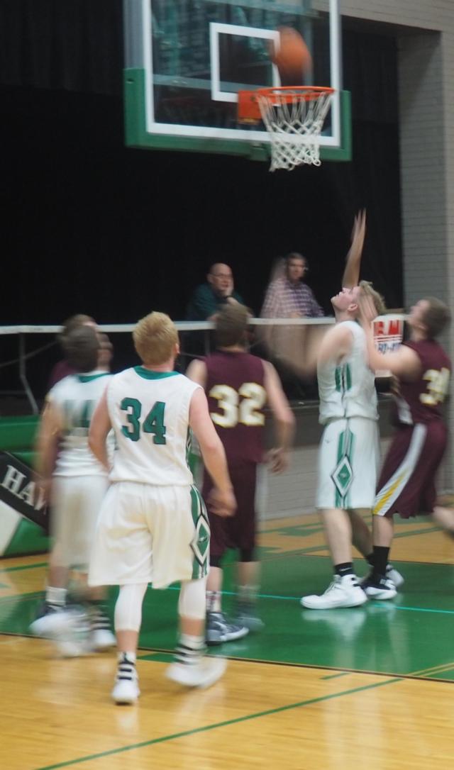 Chase McAdams slides in for a bucket.