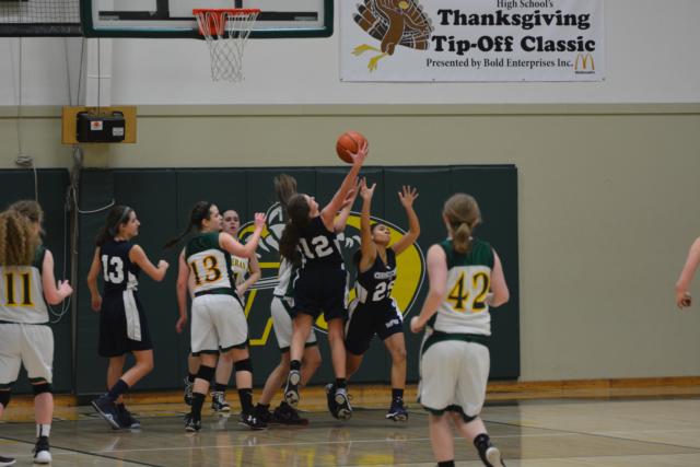 This is a battle of the boards in Metro East Lutheran's junior varsity game that followed the contest with Mount Olive.