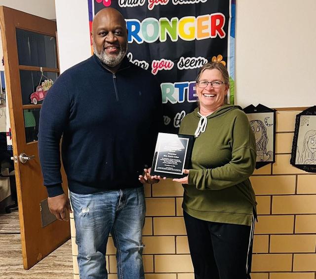 Boys and Girls Club President Al Womack presents the award to Karen Crites. Photo courtesy of Boys & Girls Club of Alton, IL, on Facebook.