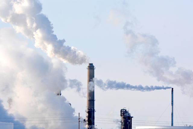 Steam and smoke billow from stacks at the Wood River Refinery/Phillips 66 is more visible when it is this cold outside.