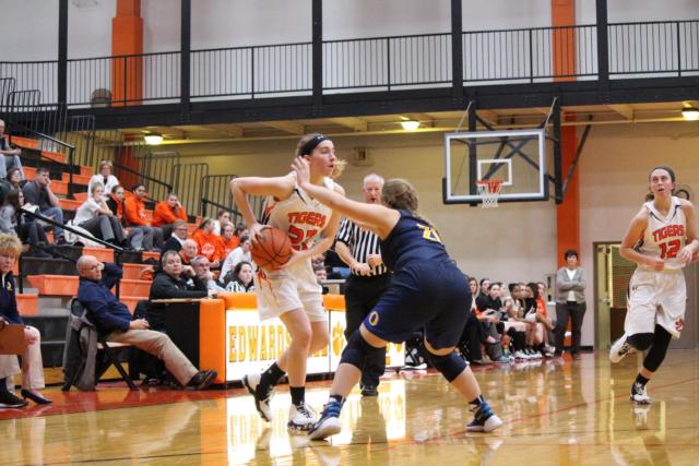 Kate Martin maneuvers around OTHS's Mckenzie Chamberlain