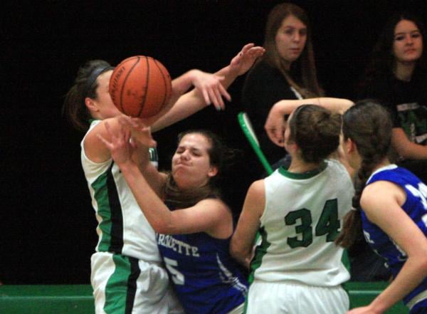 Jessica Lake and Rachel Wiliams battle for the ball in a game against Marquette.