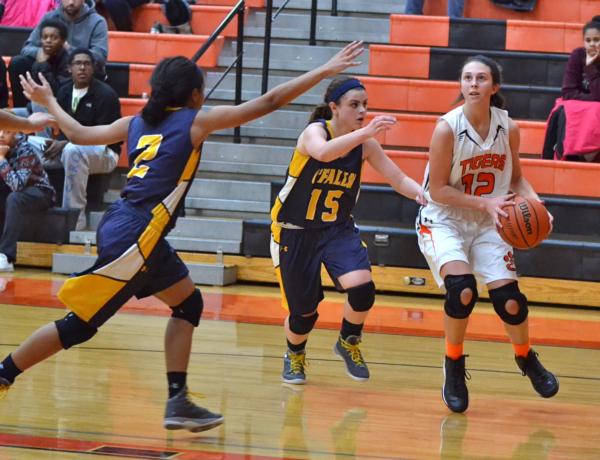 Mackenzie Silvey drives the lane against O'Fallon on Thursday night at Edwardsville. 