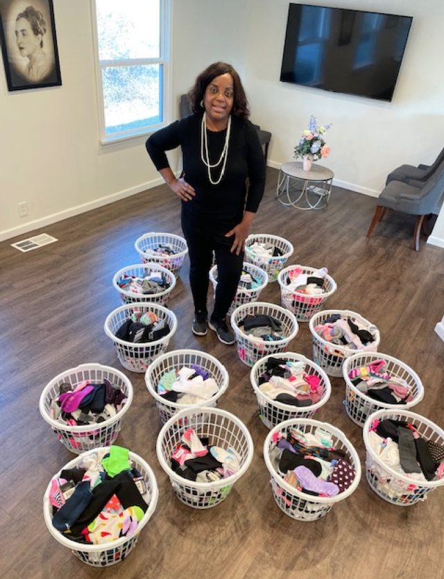 Rosetta Brown with her Socks For Tots collection.