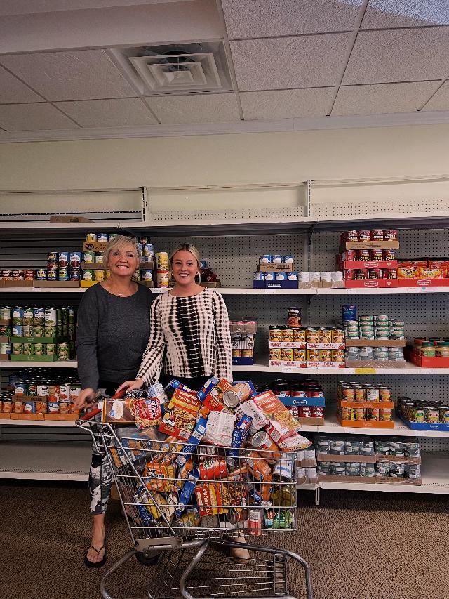 2)	Madison employee Lexy Hagler delivered food items to the Mt. Olive Care Center volunteers Chris Ramseier and Patty Makuta.