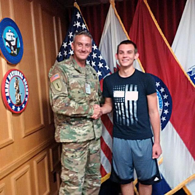 Alex Kaempfe, of Millstadt, Illinois, shakes hands with Sgt. 1st Class William Ingles, an Illinois National Guard recruiter, at the St. Louis Military Entrance Processing Station Oct. 21, 2016. Kaempfe enlisted as an 11B, Infantryman, and will be assigned to Company M, Recruit Sustainment Program, based in Shiloh, Illinois.