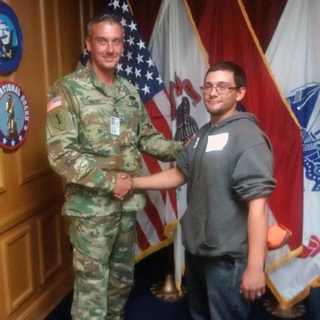 Pvt. Mark Clatto, of St. Louis, Missouri, shakes hands with Sgt. 1st Class William Ingles, an Illinois National Guard recruiter, at the St. Louis Military Entrance Processing Station Oct. 31, 2016. Clatto enlisted as an 11B, Infantryman, and will be assigned to Company M, Recruit Sustainment Program, based in Shiloh, Illinois.