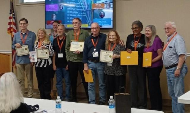 In this photo of the awardees, Lake is fourth from the right.