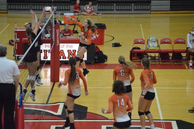 The Tigers' Alice Martin delivers a strong spike. (Photo by Brent Feeney)