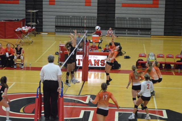 The Tigers' Corrine Timmerman is shown at the net. (Photo by Brent Feeney)