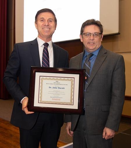 Photo (L-R): Jeff Darabi, professor in the SIUE School of Engineering receives the 2019 Paul Simon Outstanding Teacher-Scholar Award from Graduate School Dean Jerry Weinberg.