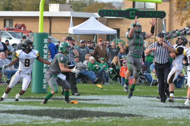 Hawks' sophomore Byron Holmes (No. 31) goes high in the air for the ball. (Photo by Dan Brannan)