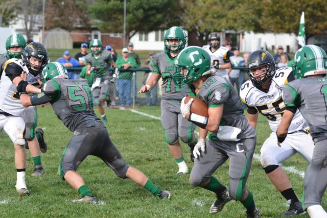 Jeremy Watson on one of his three touchdown scampers. (Photo by Dan Brannan)