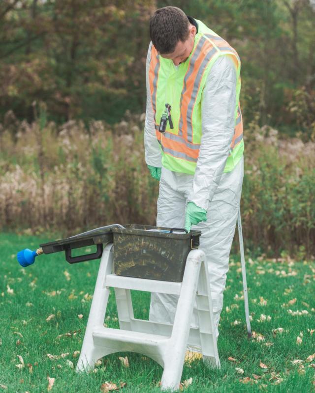 Sgt. 1st Class Jordan Schisler, of Monmouth, Illinois with the 5th Civil Support Team performs an air sample test during a training exercise near a nuclear plant outside Maroa. The samples were then brought back to IEMA's mobile command center for further testing. (U.S. Army photo by Staff Sgt. Robert R. Adams, Public Affairs).