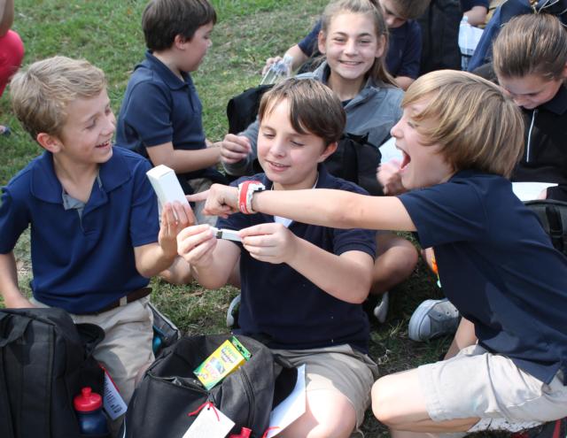 Fifth graders from the Ascension Parish School District in Sorrento, Louisiana look through the backpacks their Illinois counterparts sent them as part of the project. Photo credit: Lewis and Clark Community College