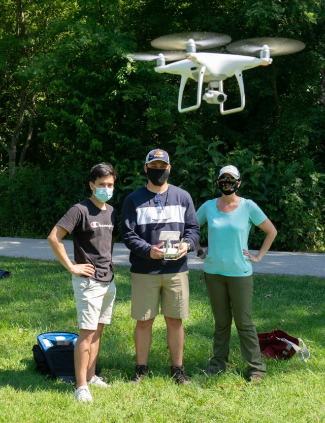 (L-R) SIUE geoscholars Jesus Sanchez and Logan Pelo use a drone to photograph land cover at the Watershed Nature Center. Looking on is GEOPATHS co-PI Adriana Martinez, PhD, associate professor in the Departments of Environmental Sciences and Geography.