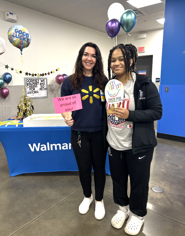 Godfrey Walmart Manager Courtnie Howes and wrestler Antonia Phillips.