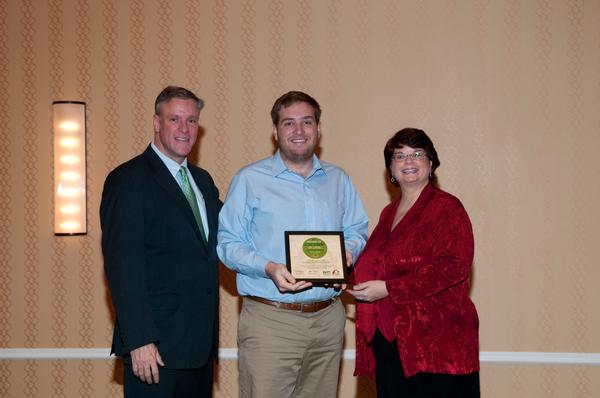 RCGA President and CEO Joe Reagan and Missouri Botanical Garden EarthWays Center Director Glenda Abney present L&C Sustainability Coordinator Ted Kratschmer with the St. Louis Green Business Challenge Circle of Excellence award. Photo by Bueltmann Photography