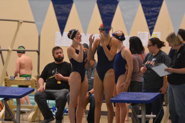 Victoria Thomae and Bailey Grinter share a moment before a race this past Saturday. (Photo by Dan Brannan)