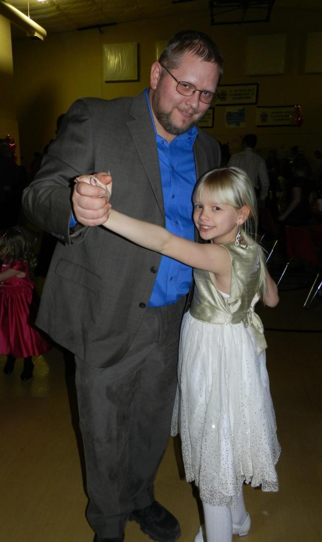 Jerseyville residents, Camryn Johnson, then 8, and her dad, Shane Johnson, strike a pose while dancing at the 2016 Daddy & Daughter Valentine Dance.