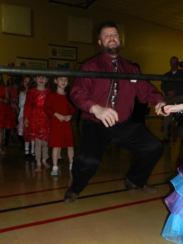D.J. Kroeschel, a super-dad of Jerseyville, went low under the limbo pole at the 2016 JPRD Daddy & Daughter Valentine Dance.